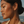 Load image into Gallery viewer, Model wearing Umutoni Anga gold earrings with refined summer occasion styling.
