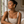 Load image into Gallery viewer, Model wearing Umutoni Asani gold earrings with elevated everyday styling.
