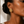 Load image into Gallery viewer, Close up - Model wearing Umutoni Asani gold earrings, handmade in Kenya.
