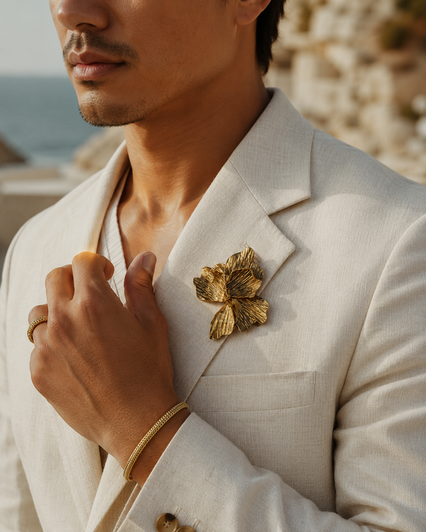 Male model wearing the Umutoni Malkia brooch and Imara gold bangle and ring , handmade in Kenya.