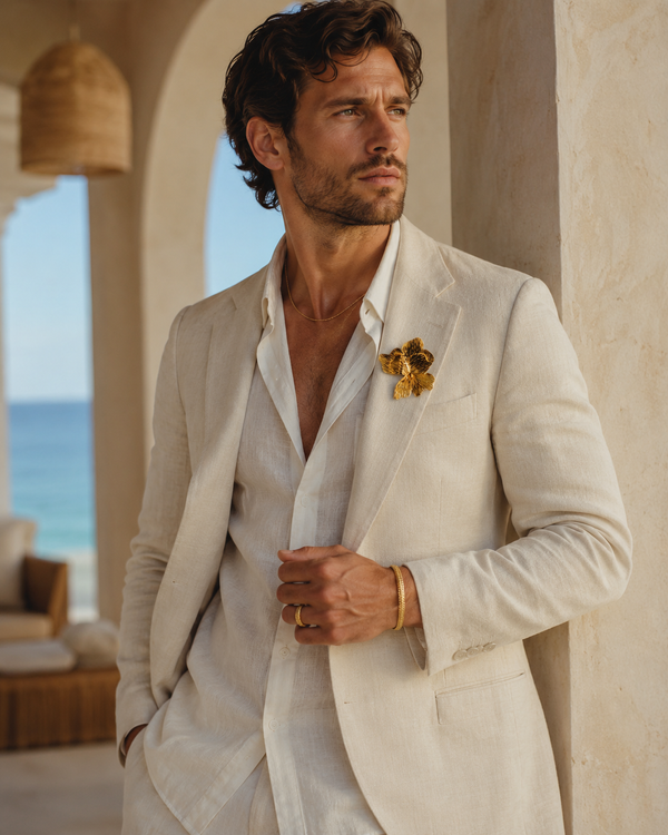 Male model wearing the Umutoni Malkia brooch and Imara gold bangle, handmade in Kenya.