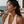 Load image into Gallery viewer, Model wearing Umutoni Nalla gold earrings, handmade in Kenya.
