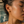 Load image into Gallery viewer, Model wearing Umutoni Nalla gold earrings, handmade in Kenya.
