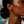 Load image into Gallery viewer, Model wearing Umutoni Nalla gold earrings, handmade in Kenya.
