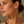Load image into Gallery viewer, Model wearing Umutoni petali gold flower earrings with elevated everyday styling.
