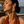 Load image into Gallery viewer, Model wearing Umutoni Terema gold earrings, handmade in Kenya.
